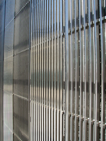 The new 7 WTC has a curtain wall with stainless steel louvers reminiscent of its predecessors.